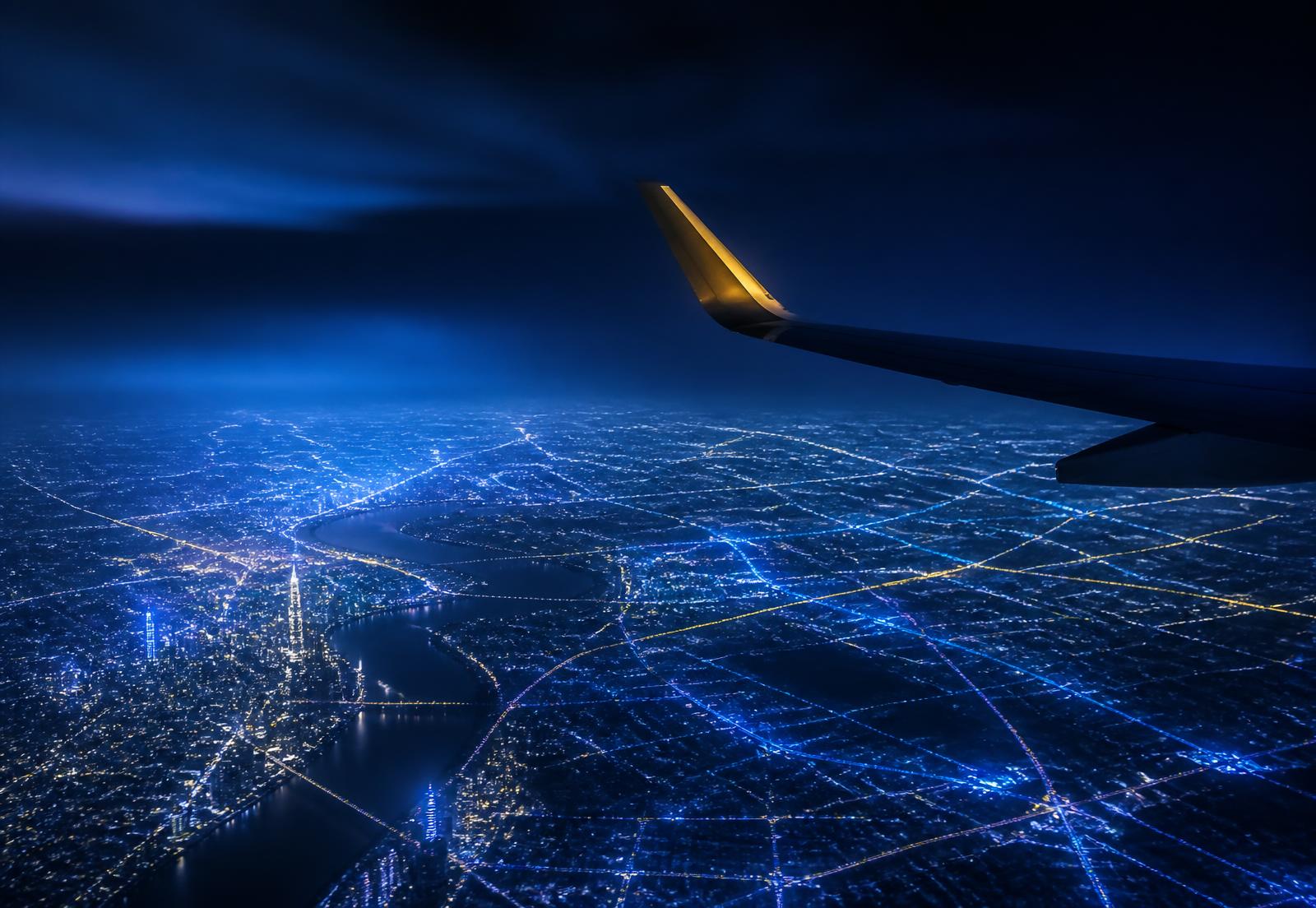 Aerial night view of connected city corridors seen from altitude